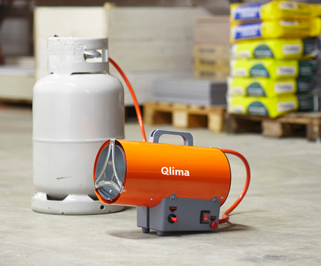 Qlima GFA 1010 direct fired diesel heater attached to a gas bottle working in a warehouse